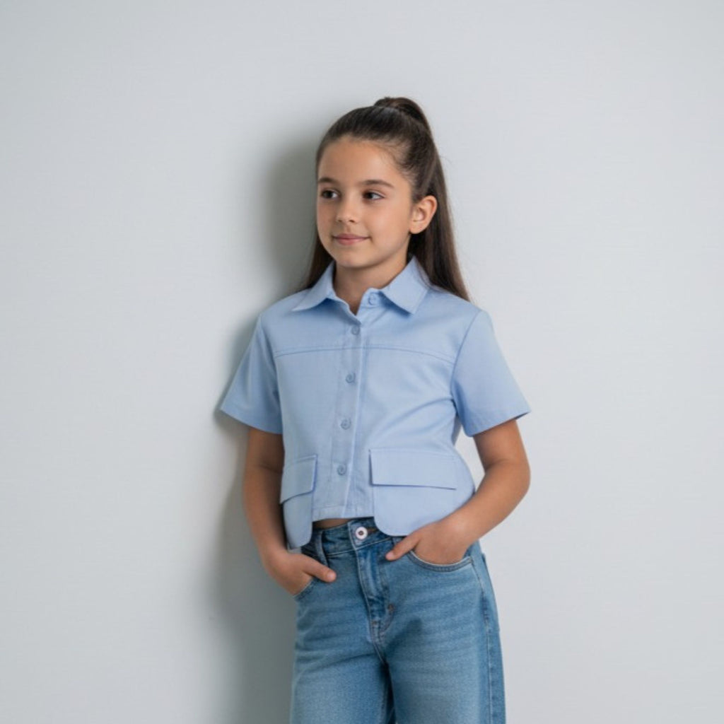 Blusa Celeste para Niña con Bolsillos Delanteros