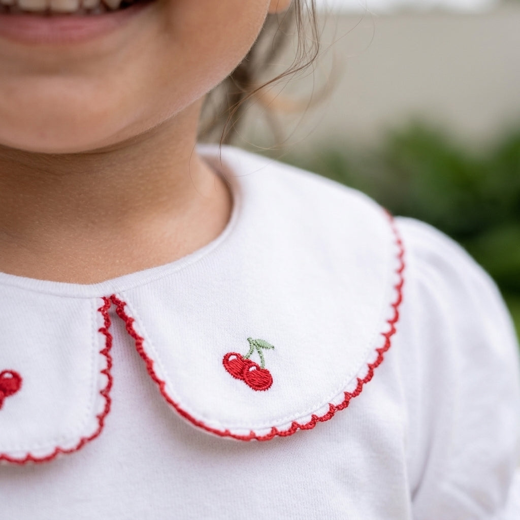 Polo de algodón para niña con cuello de cerezas